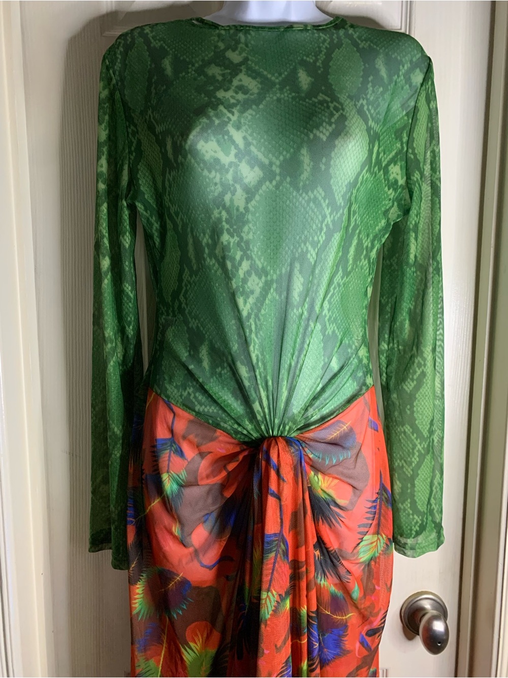 tropical twist sheer dress features a green snake-print top with long sleeves